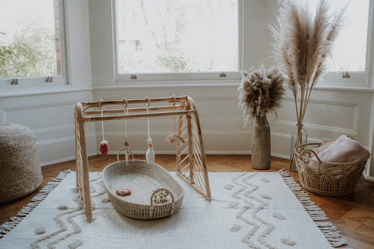 Rattan baby play gym with hanging toys