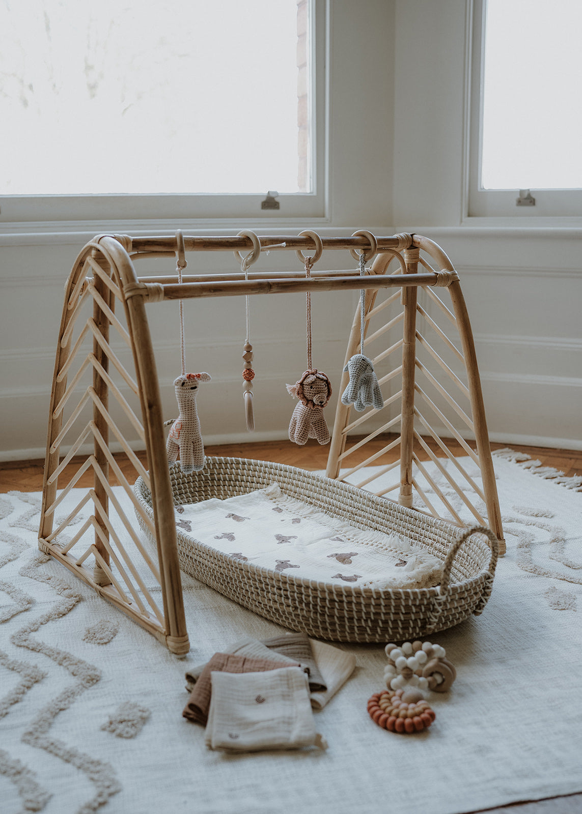 Rattan baby play gym with hanging toys