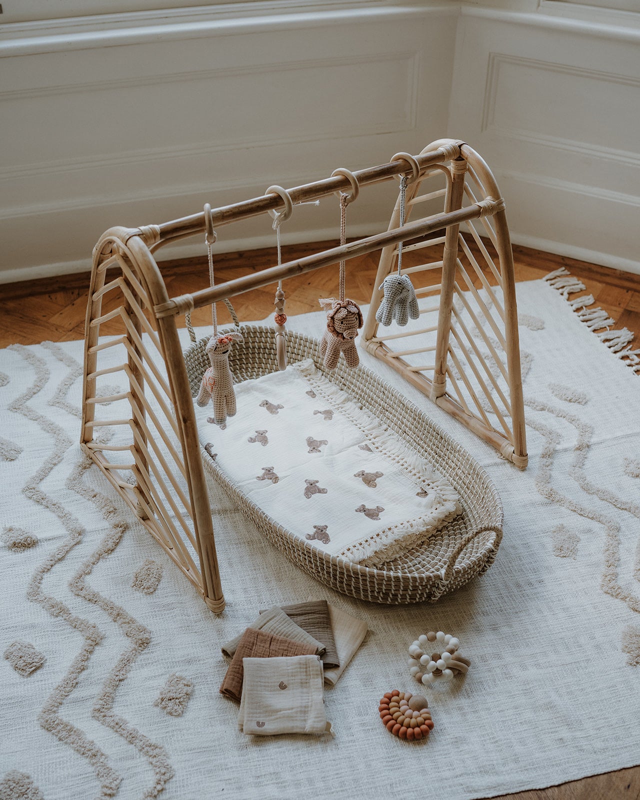 Rattan baby play gym with hanging toys