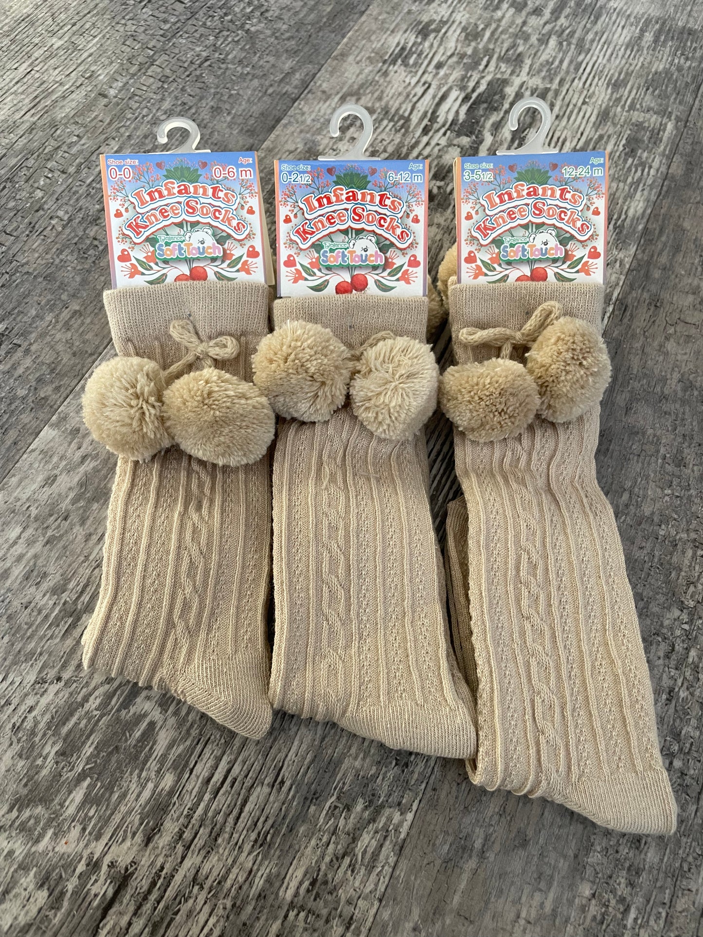 Beige knee high pom pom socks