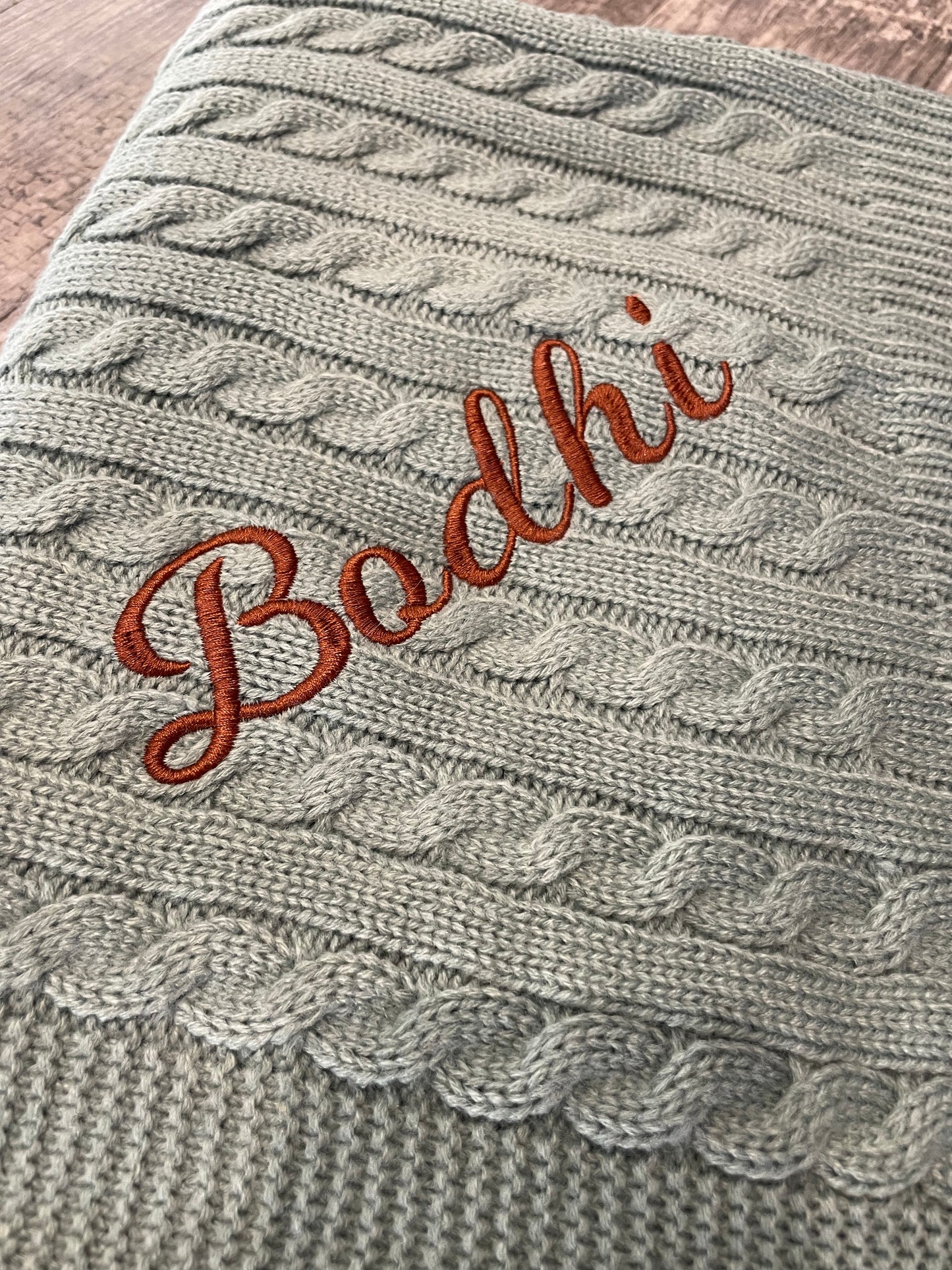 Personalised sage green cable knit wrap blanket