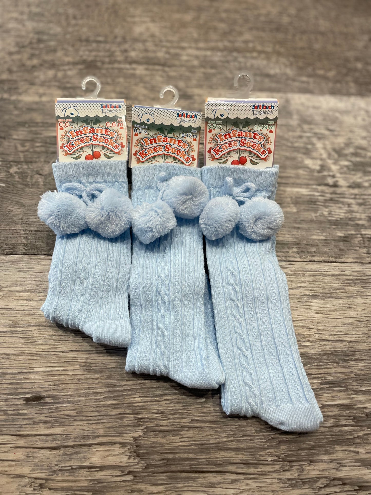 Baby blue knee high pom pom socks